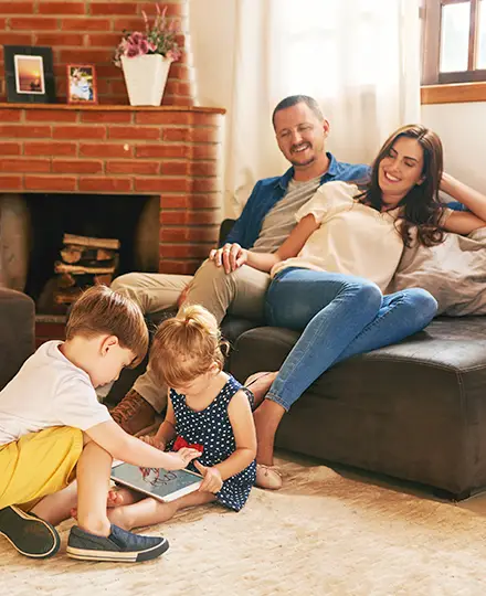 Family at home on the sofa
