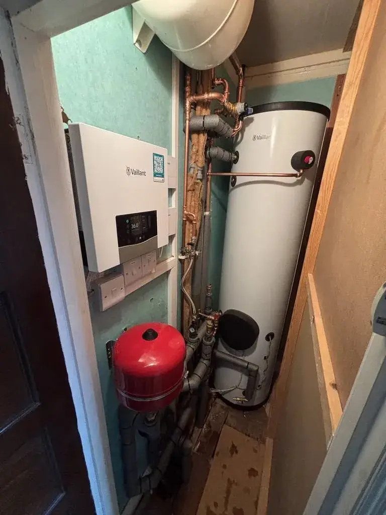 Vaillant 210L unvented cylinder and Vaillant controls in an airing cupboard in Hove
