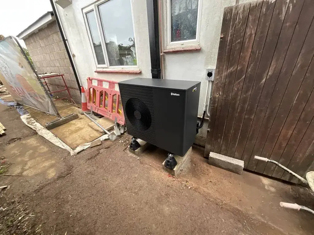 Vaillant aroTHERM plus 7kW air source heat pump installed beside a house in Hove